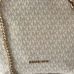 Michael Kors vanilla/cream colored. Very cute, new